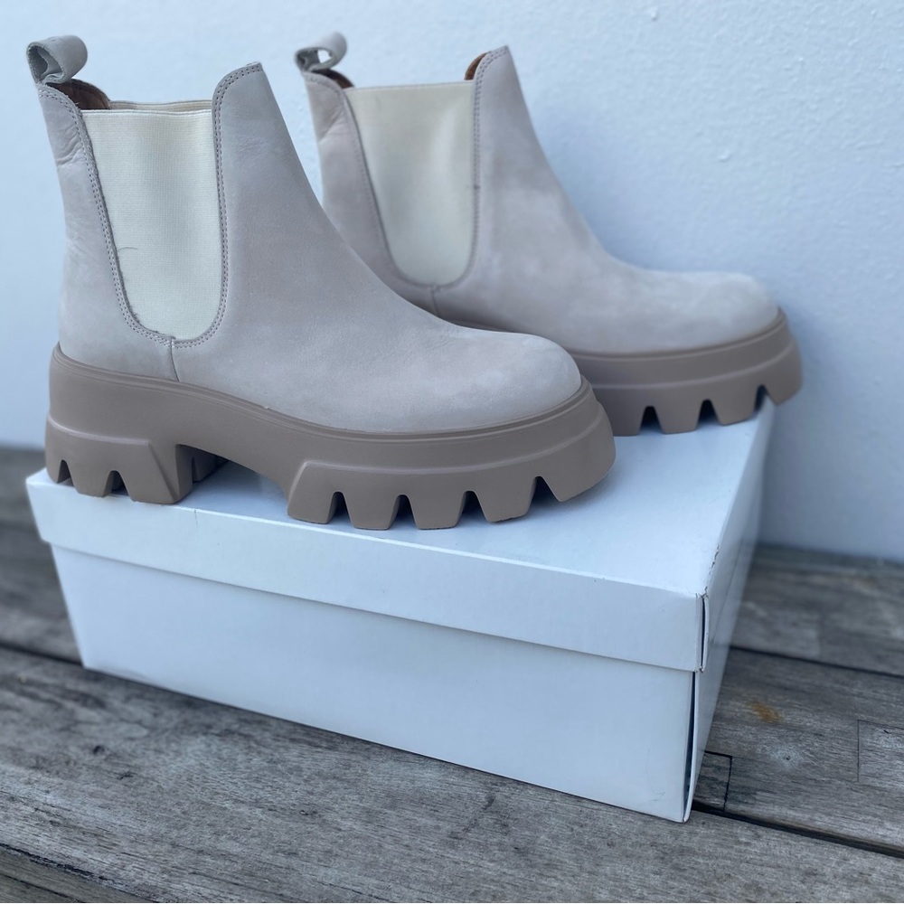 Never worn new Toral boots. Value of $375